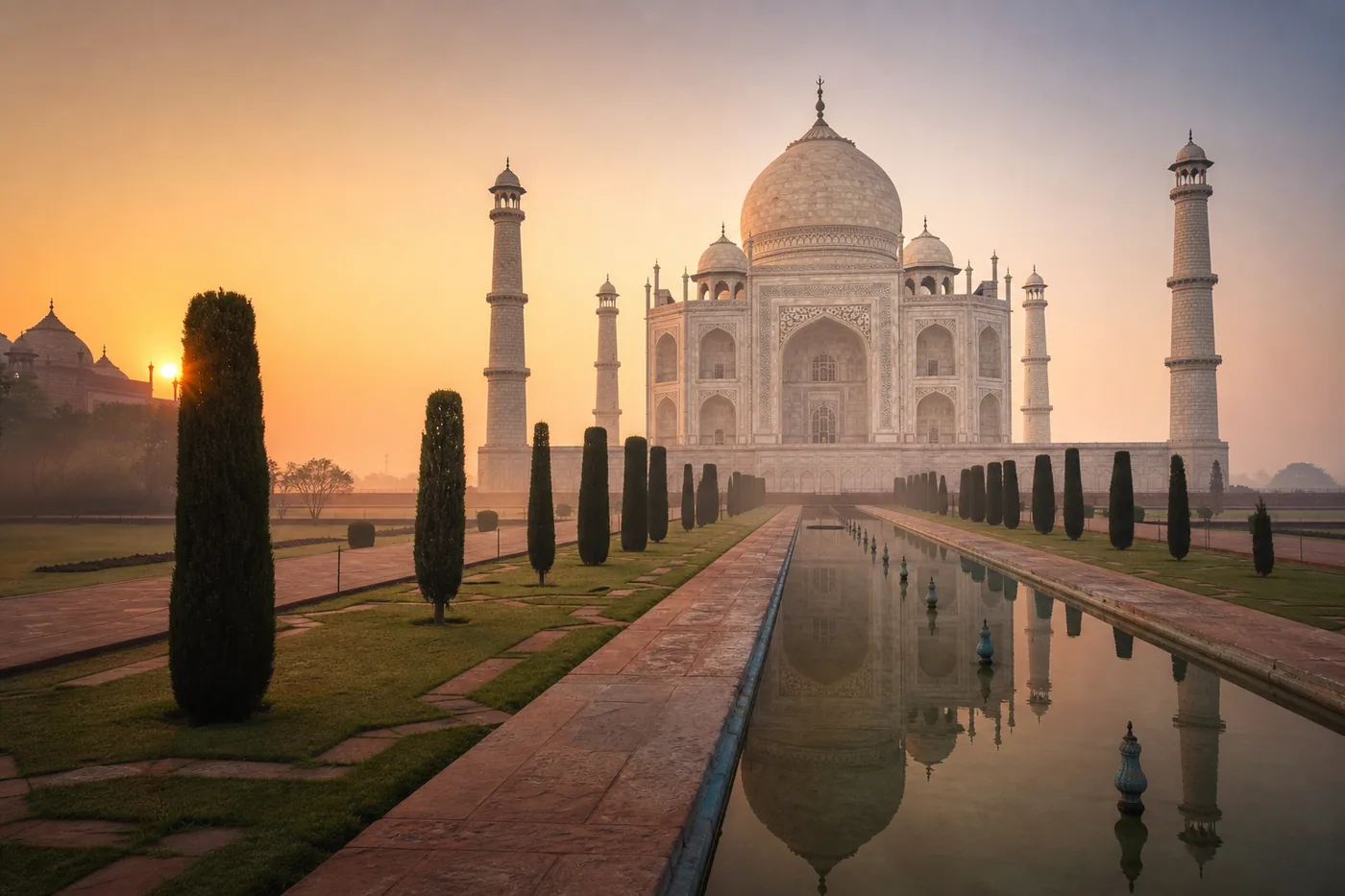 Taj Mahal and reflecting pool at sunrise in Agra